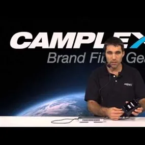 Man standing at Camplex Brand Fiber Gear desk presenting about Blackjeck Pro Headset Adapter for Blackmagic ATEM Converter